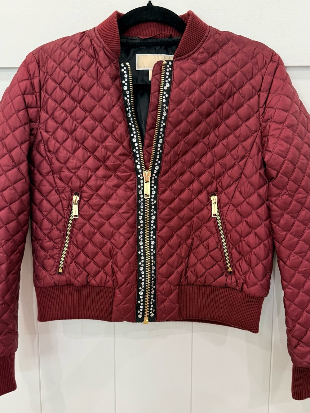MICHAEL Michael Kors Quilted Bomber Jacket in Burgundy with Gold Trim